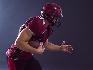 Image showing American football Player running with the ball