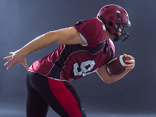 Image showing American football Player running with the ball