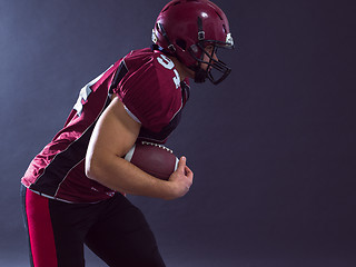 Image showing American football Player running with the ball