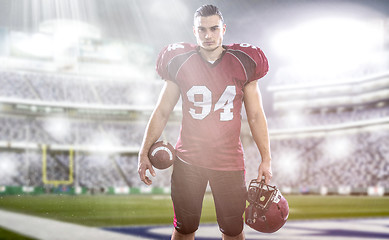 Image showing American Football Player isolated on big modern stadium field