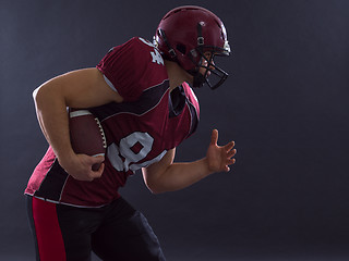 Image showing American football Player running with the ball