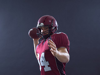 Image showing american football player throwing ball