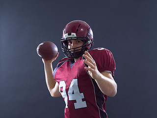 Image showing american football player throwing ball