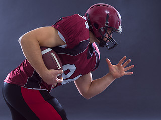 Image showing American football Player running with the ball