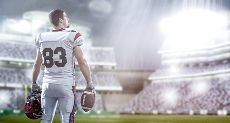 Image showing American Football Player isolated on big modern stadium field