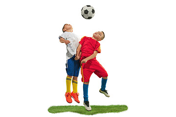 Image showing Young boys with soccer ball doing flying kick