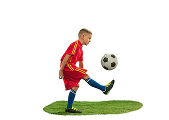 Image showing Young boy with soccer ball doing flying kick