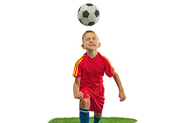 Image showing Young boy with soccer ball doing flying kick