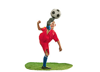 Image showing Young boy with soccer ball doing flying kick