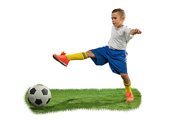 Image showing Young boy with soccer ball doing flying kick