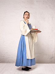 Image showing Medieval Woman in Historical Costume Wearing Corset Dress and Bonnet.