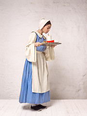 Image showing Medieval Woman in Historical Costume Wearing Corset Dress and Bonnet.