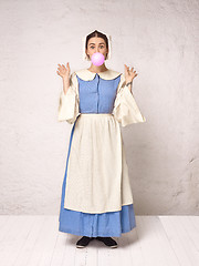 Image showing Medieval Woman in Historical Costume Wearing Corset Dress and Bonnet.