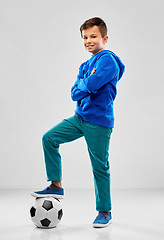 Image showing smiling boy in blue hoodie with soccer ball