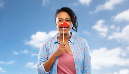 Image showing happy african american woman with red clown nose