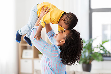 Image showing happy african american mother with baby at home