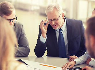 Image showing architects with tablet pc and blueprint at office