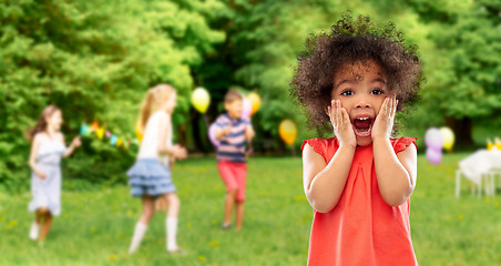 Image showing surprised african american girl at birhtday party