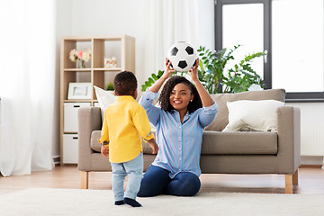 Image showing mother and baby playing with soccer ball at home