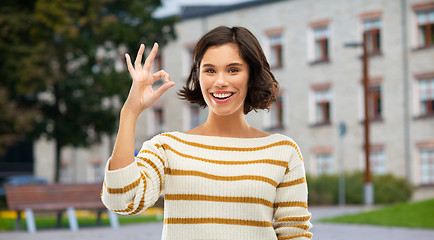 Image showing happy smiling woman or student girl showing ok