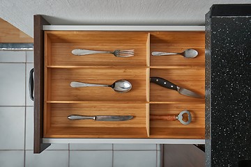 Image showing Minimalist kitchen tools put away in a drawer