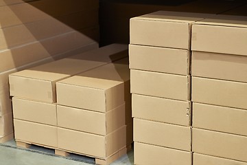 Image showing Warehouse stocked with boxes in stacks