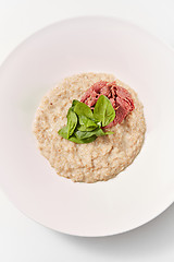 Image showing Diet food oatmeal porridge with spinach and ham in the plate.