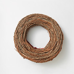 Image showing Handmade round wreath from twigs on a white