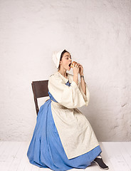 Image showing Medieval Woman in Historical Costume Wearing Corset Dress and Bonnet.