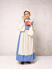 Image showing Medieval Woman in Historical Costume Wearing Corset Dress and Bonnet.