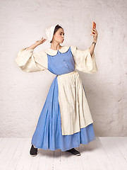 Image showing Medieval Woman in Historical Costume Wearing Corset Dress and Bonnet.