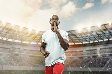 Image showing The football player in motion on the field of stadium