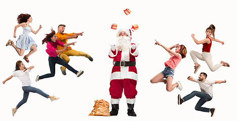 Image showing Happy running Christmas people over white background