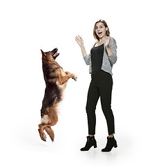 Image showing Woman with her dog over white background