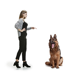 Image showing Woman with her dog over white background