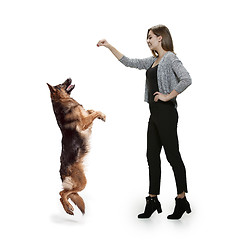 Image showing Woman with her dog over white background