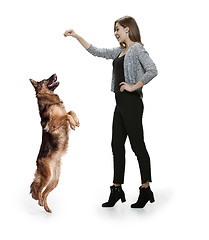 Image showing Woman with her dog over white background