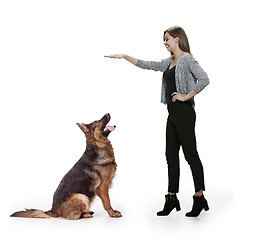 Image showing Woman with her dog over white background