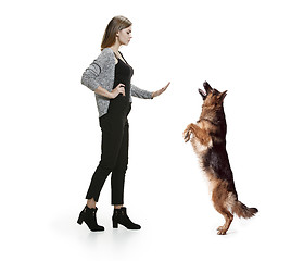 Image showing Woman with her dog over white background