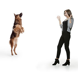 Image showing Woman with her dog over white background