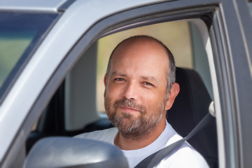 Image showing bearded man sitting in his car