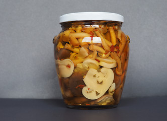 Image showing mixed champignons and porcini mushrooms in jar