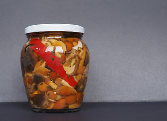 Image showing mixed champignons and porcini mushrooms in jar