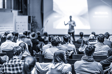 Image showing Male public peaker giving presentation on business conference event.