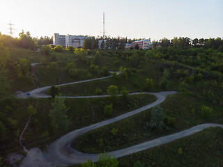 Image showing Aerial top vew of winding road in the city