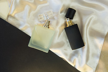 Image showing Flat lay composition with two perfume bottles