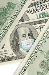 Image showing 100 dollar banknote with medical mask.