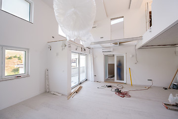 Image showing carpenters installing glass door with a wooden frame