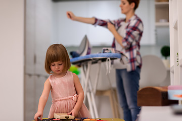 Image showing mother and daughter spending time together at home