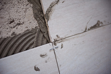 Image showing Ceramic tiles and tools for tiler